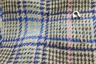 Finished invisible mend on plaid fabric