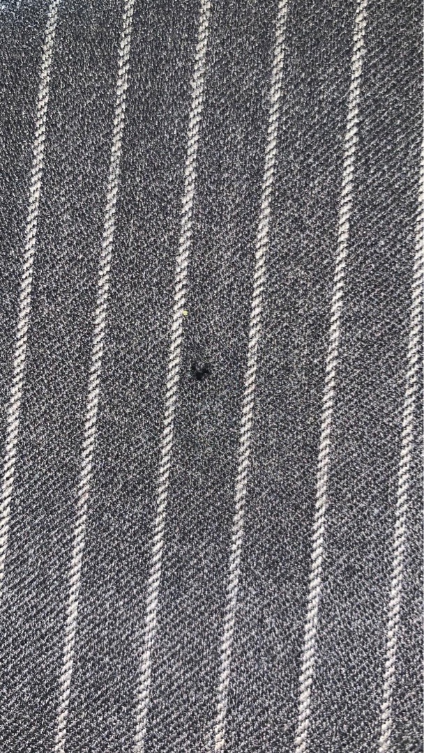 Grey pinstripe suit after invisible mend