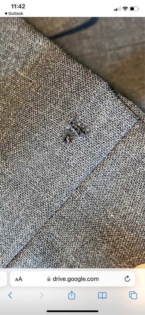 Grey fabric with circled damage area